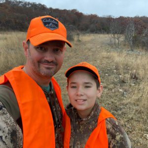 Blog - Father with Daughter Dressed in Orange Vests and Camo While They Go Hunting